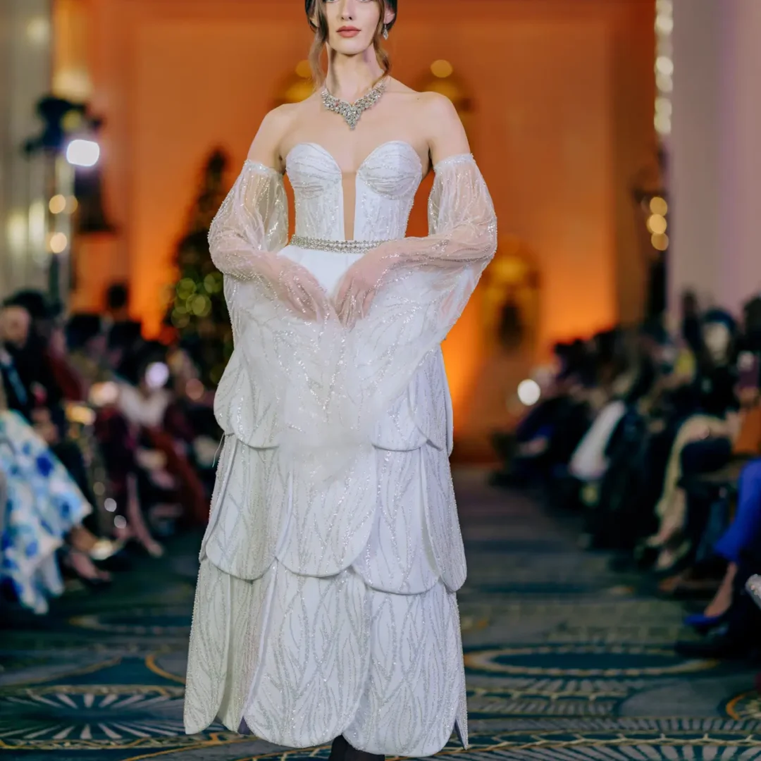 Majestic Hera haute couture gown with peacock-inspired rhinestones and plumage details